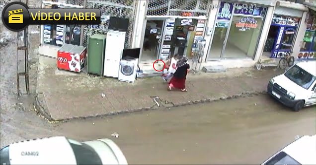 Küçük kız fırlayan taştan kıl payı kurtuldu